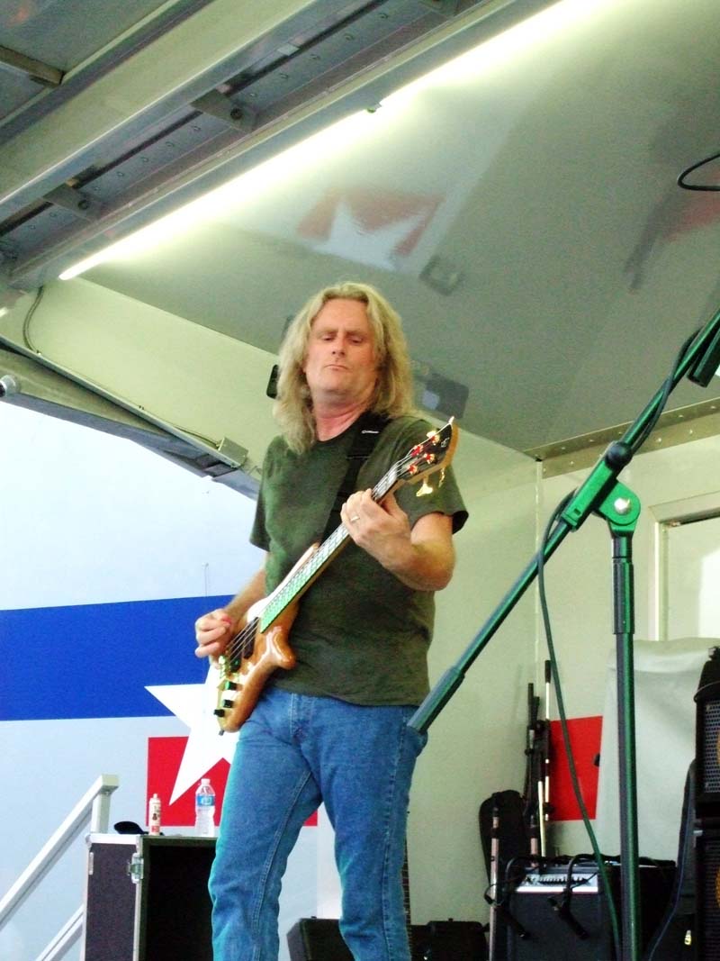 photo of man playing guitar